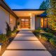 Ontario home exterior with low voltage lighting illuminating pathway.