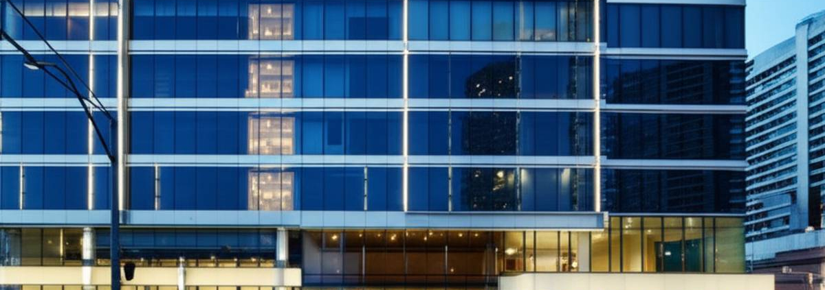 Toronto building facade with energy-efficient low voltage lighting solutions at twilight.