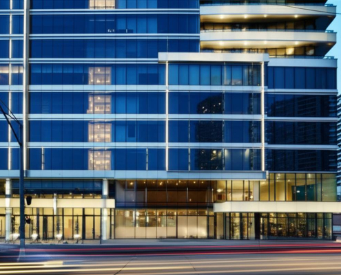 Toronto building facade with energy-efficient low voltage lighting solutions at twilight.