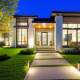 GTA home exterior with low voltage landscape lighting at twilight.