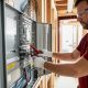 Electrical panel upgrade Toronto: Qualified electrician at work.