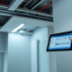 Modern interior with sleek recessed LEDs and a smart control panel, highlighting PowerSol's wireless smart lighting Toronto expertise.