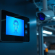 Advanced AI Home Security GTA system by PowerSol, featuring a sleek facial recognition panel and discreet CCTV camera for ultimate protection.